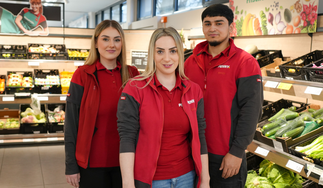 Three employees in the vegetables department