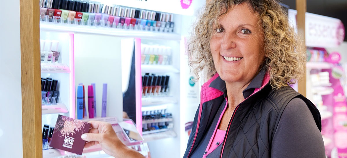 An employee showing a product