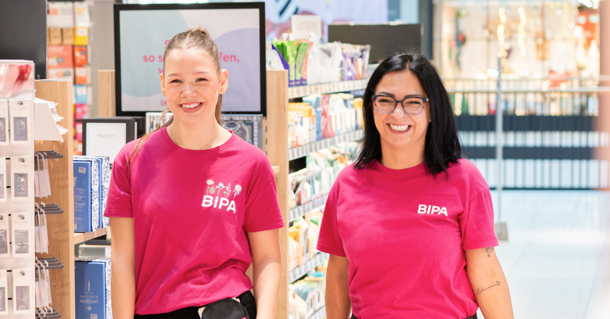 Two smiling employees.