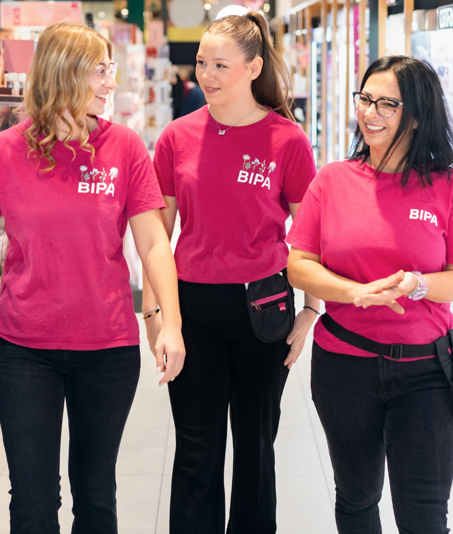 Three smiling employees.