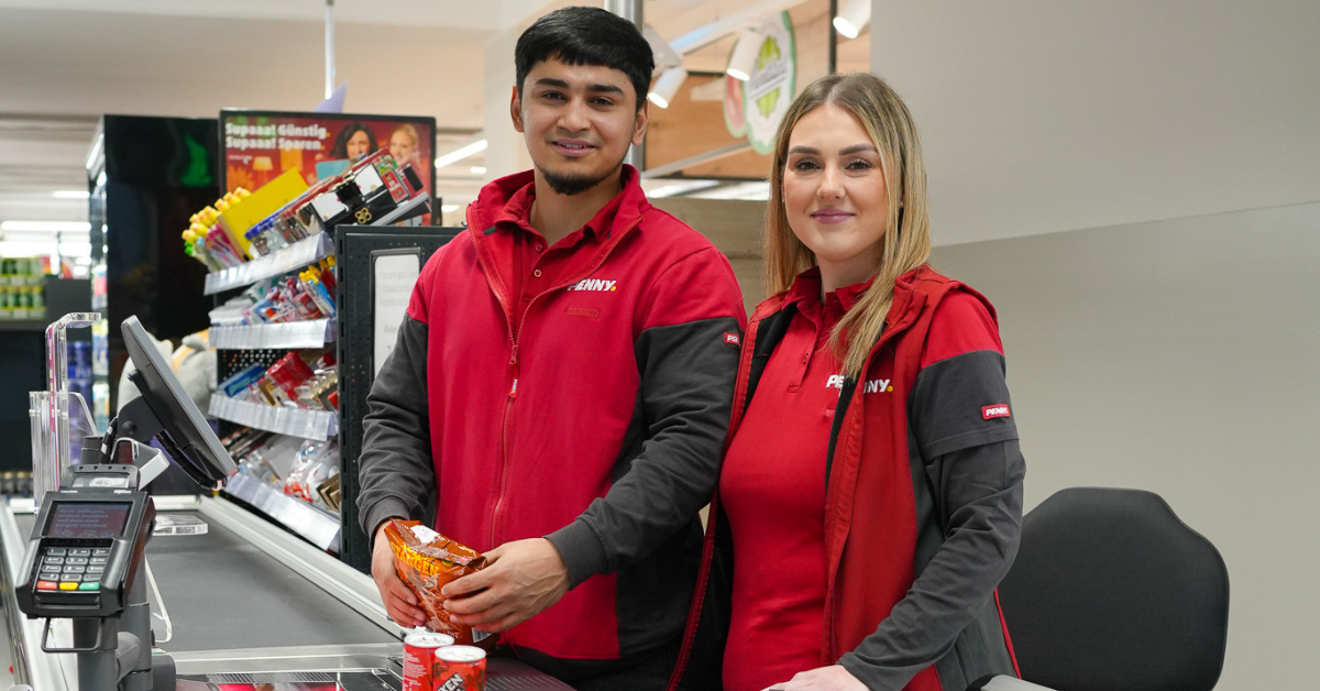 Two smiling employees