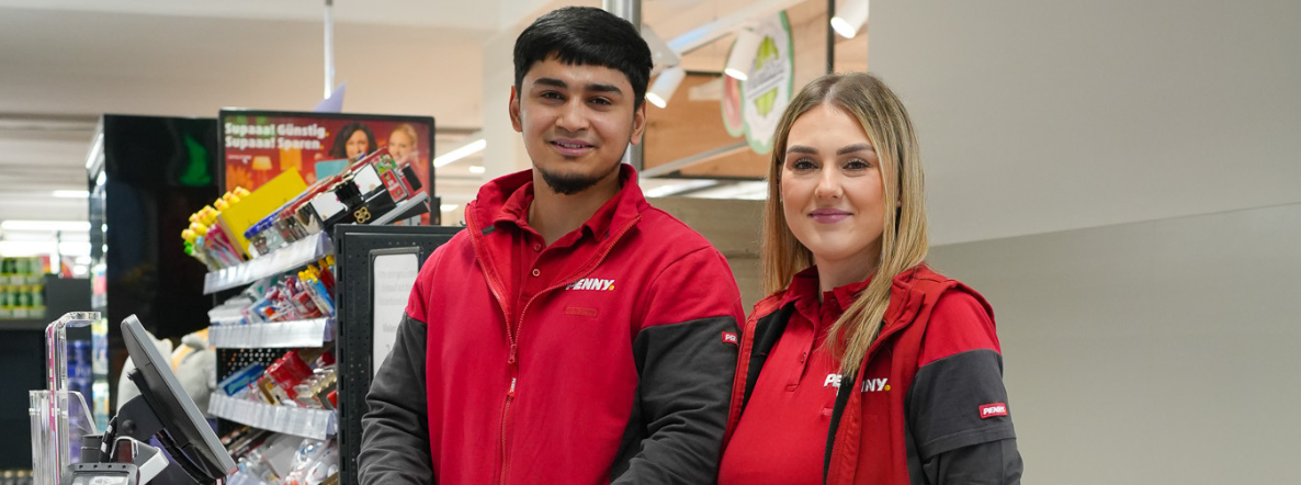 Two smiling employees